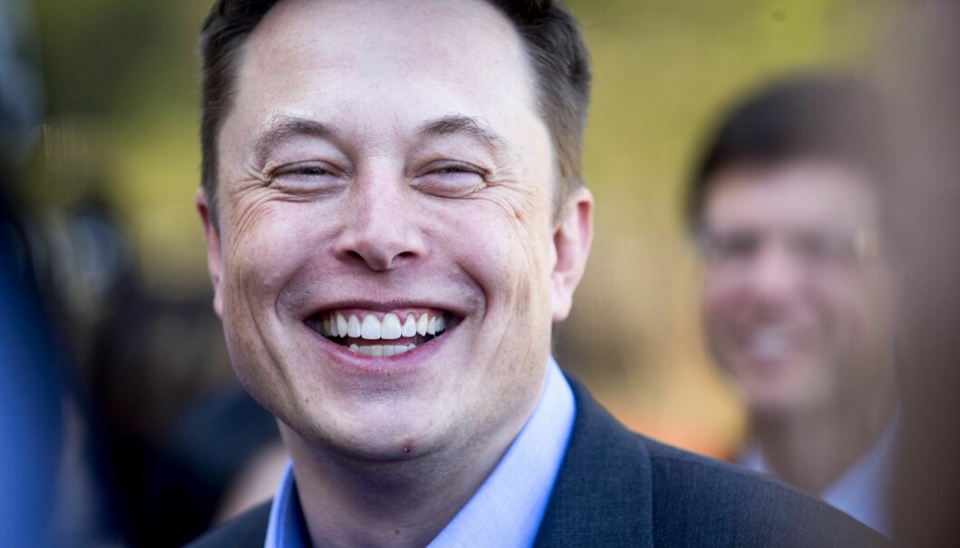 Tesla CEO Elon Musk speaks with members of the media at Tesla's headquarters in Palo Alto, Calif., Thursday, April 30, 2015. (AP Photo/Noah Berger)