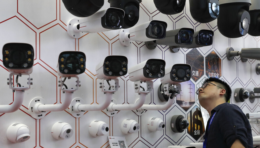 A man takes a closer look at the surveillance cameras by China's telecoms equipment giant Huawei on display at the China Public Security Expo in Shenzhen, China's Guangdong province A man takes a closer look at the surveillance cameras by China's telecoms equipment giant Huawei on display at the China Public Security Expo in Shenzhen, China's Guangdong province